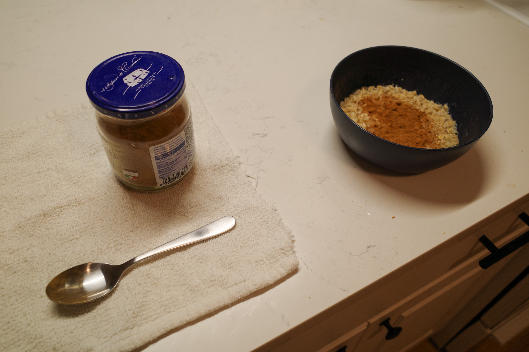 Morning meal prep: half-cup oatmeal, pre-mixed cinnamon sugar, whole milk, kosher salt