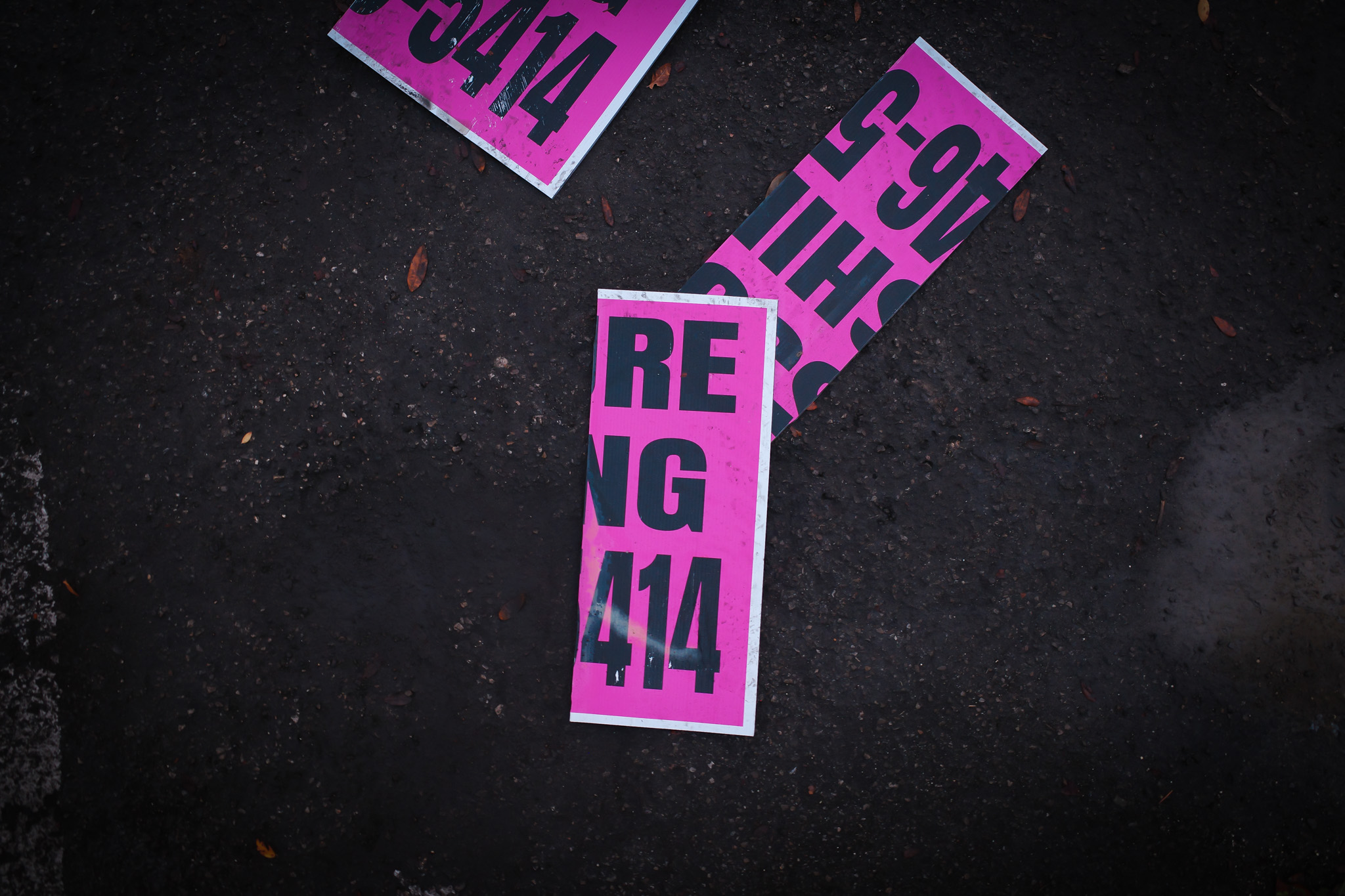 Pink signs in the parking lot