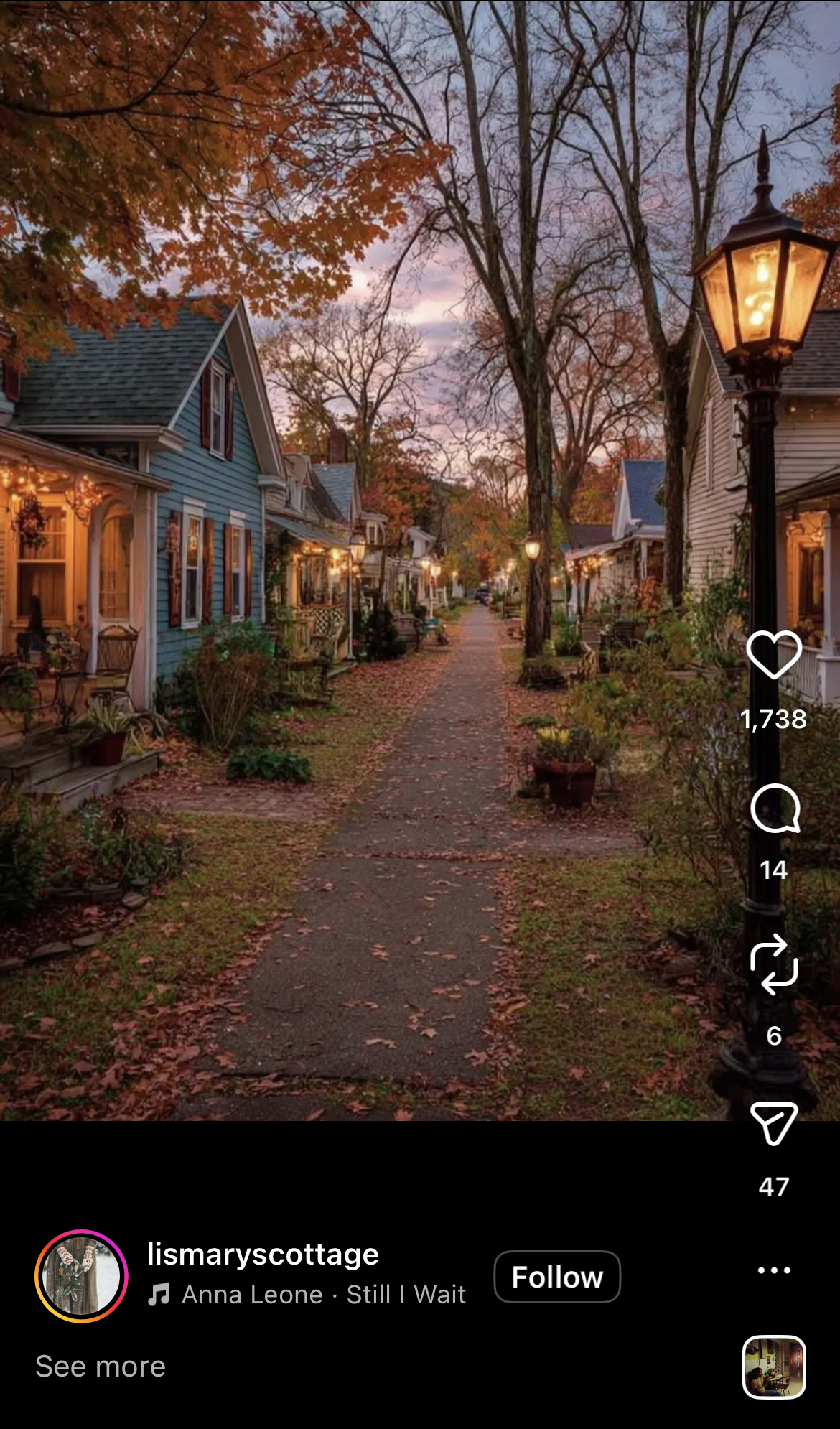 A quiet, romantic walkway between houses lit by warm streetlamps at night