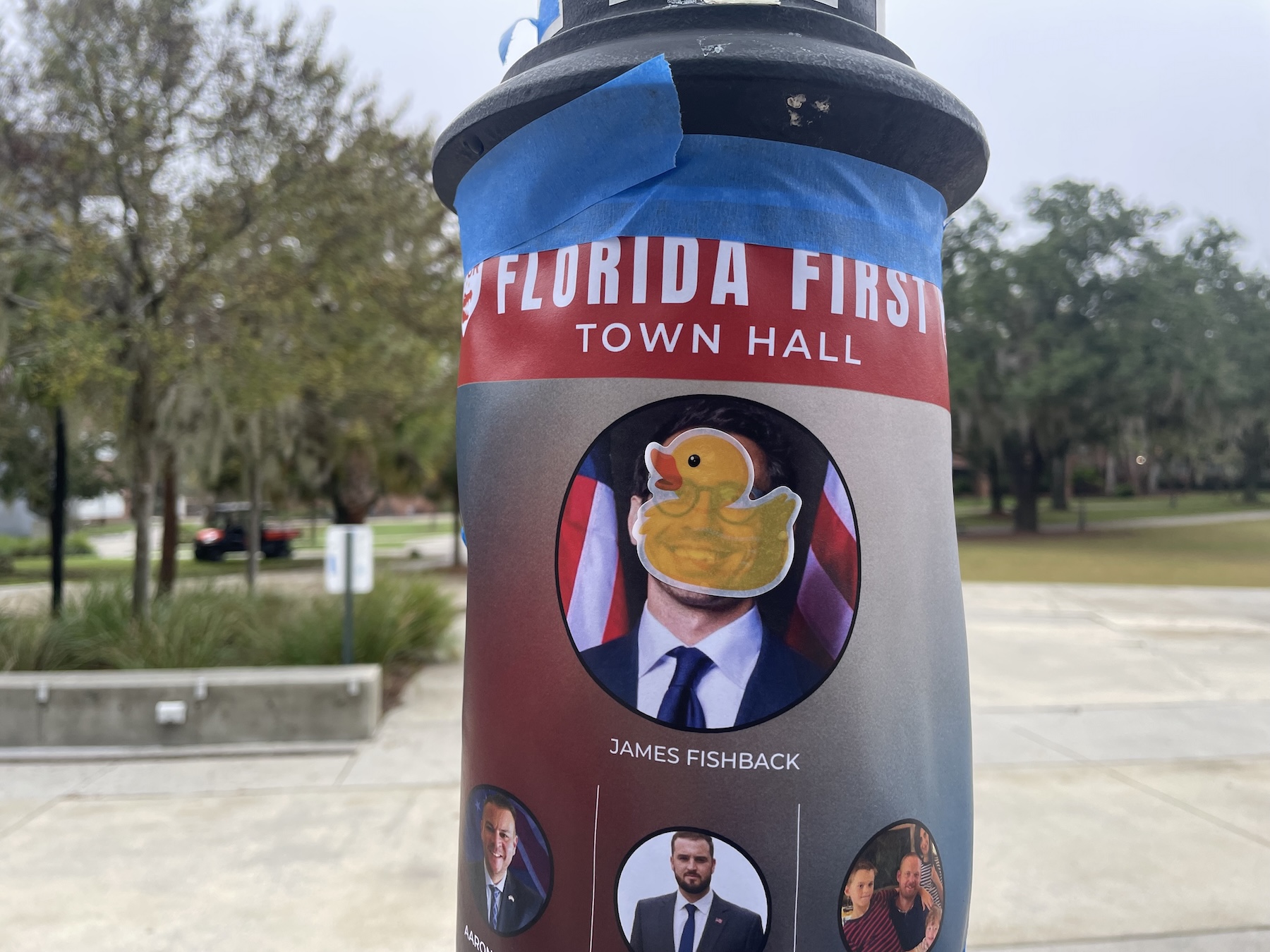 Campus flyer with a duck sticker covering the speaker’s face