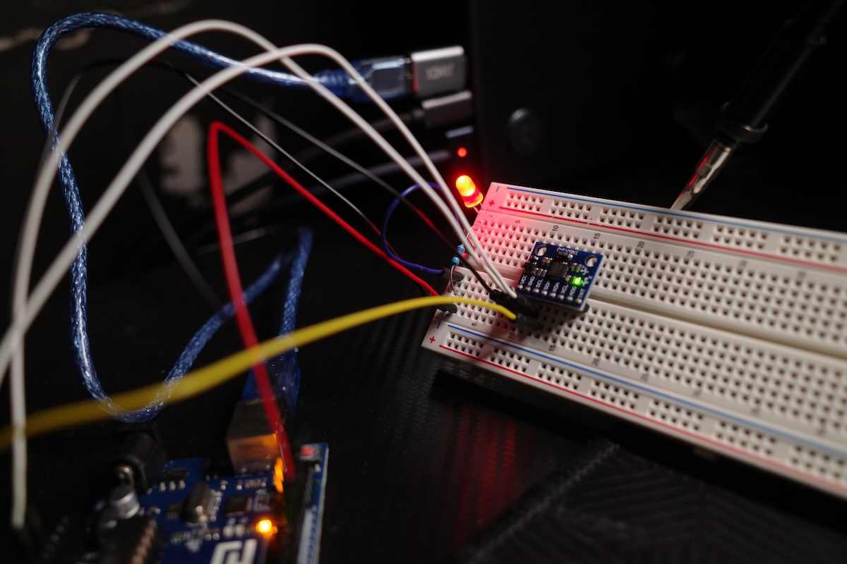 Arduino breadboard with red LED and GY-521 tilt sensor controlling light